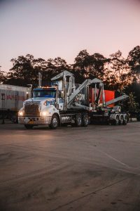 A sideloader truck delivering containers with no loading dock.